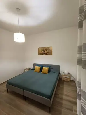Letto o letti in una camera di Appartamento Violet - Parma