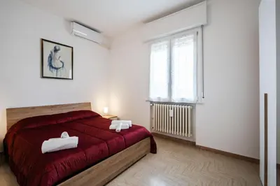 Letto o letti in una camera di IZZ1 Apartments - Motor&Food Valley - Posto Auto Privato