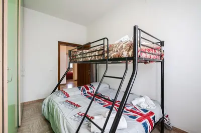 Letto o letti in una camera di IZZ1 Apartments - Motor&Food Valley - Posto Auto Privato