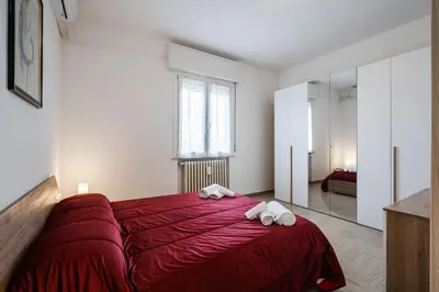 Letto o letti in una camera di IZZ1 Apartments - Motor&Food Valley - Posto Auto Privato