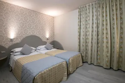 Letto o letti in una camera di Marchi Hotel