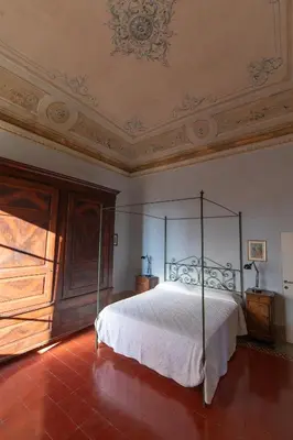 Letto o letti in una camera di Palazzo Augusto