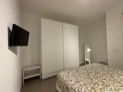 Letto o letti in una camera di SUITE NAVIGLIO 26