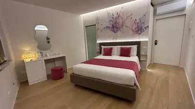 Letto o letti in una camera di SAN LORENZO Luxury Boutique