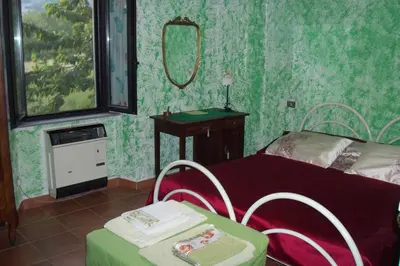 Letto o letti in una camera di Borgoeden