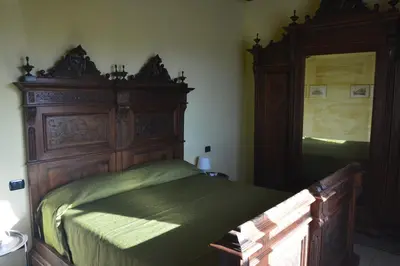 Letto o letti in una camera di Ca'Os Locanda&Grill
