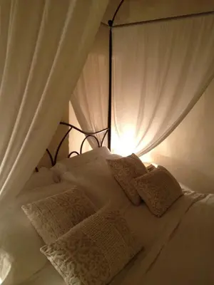 Letto o letti in una camera di Torre del Barbagianni - Castello di Gropparello