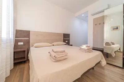 Letto o letti in una camera di Mentana Rooms