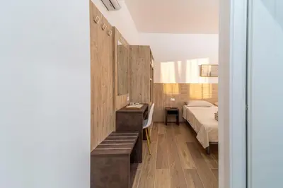 Letto o letti in una camera di Mentana Rooms