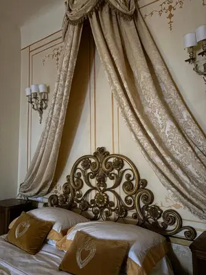 Letto o letti in una camera di Palazzo Lari Sarzana - Historic Boutique Rooms