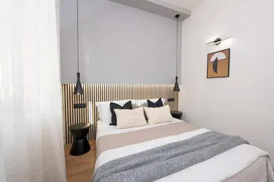 Letto o letti in una camera di 224 - Ma & Ma Luxury Apartment, 500metri da mare e spiaggia, vicino alla Baia del Silenzio - PARCHEGGIO GRATIS PRIVATO INCLUSO