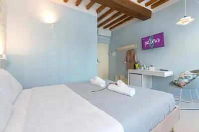Letto o letti in una camera di GLAM PARMA