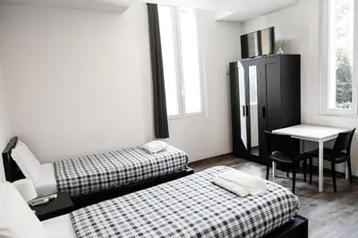 Letto o letti in una camera di Residence del Centro