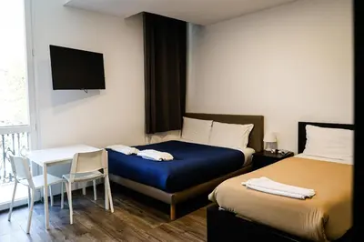 Letto o letti in una camera di Residence del Centro