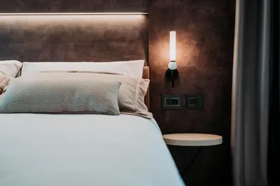 Letto o letti in una camera di Hotel De Amicis