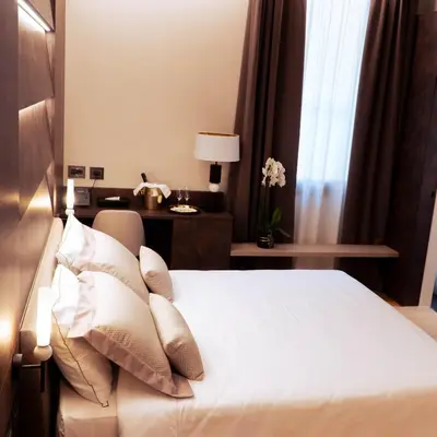 Letto o letti in una camera di Hotel De Amicis