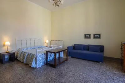 Letto o letti in una camera di MATTEOTTI ROOMS