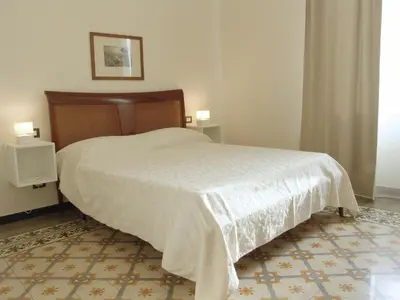 Letto o letti in una camera di Residenza Cavour - Appartamento AGAVE