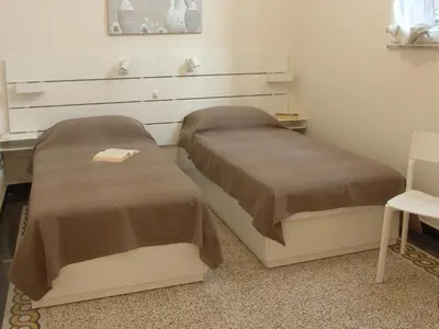 Letto o letti in una camera di Residenza Cavour - Appartamento AGAVE