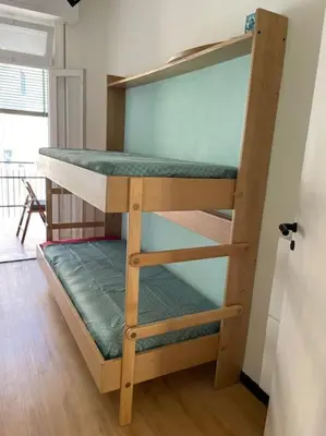 Letto o letti in una camera di A due passi dalla spiaggia