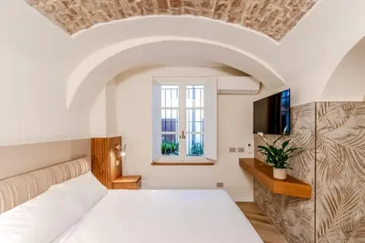 Letto o letti in una camera di Parco Ducale Design Rooms