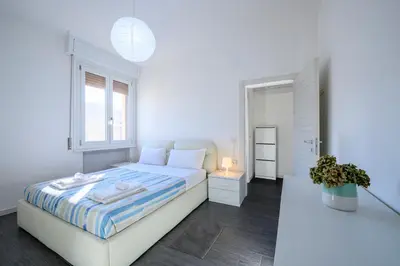 Letto o letti in una camera di GuestHost - Parma Station & City Center Apartment