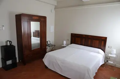 Letto o letti in una camera di DOMUS AQUENIGRE