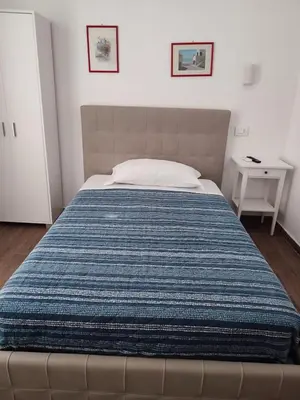 Letto o letti in una camera di ALO ALO ALBERGO
