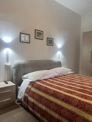 Letto o letti in una camera di ALO ALO ALBERGO