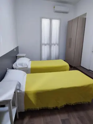 Letto o letti in una camera di ALO ALO ALBERGO