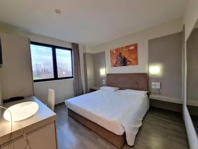 Letto o letti in una camera di Hotel Motel Piu'