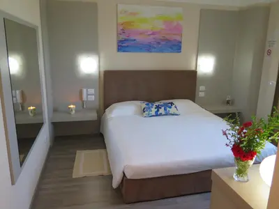 Letto o letti in una camera di Hotel Motel Piu'