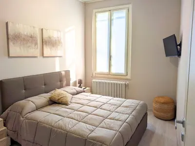 Letto o letti in una camera di Maison del Ducato Suite Correggio