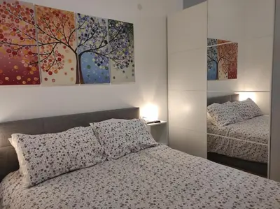 Letto o letti in una camera di KAIROS RESIDENCE