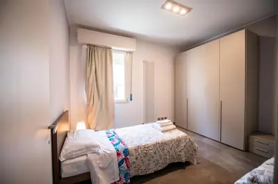 Letto o letti in una camera di Porta Galileo l Comfort Rooms & Parking