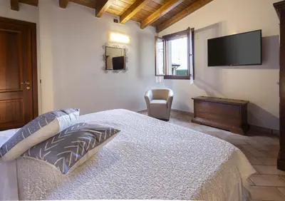 Letto o letti in una camera di Agriturismo Il Brugnolo