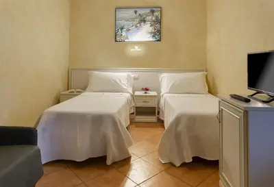 Letto o letti in una camera di Agriturismo Il Brugnolo