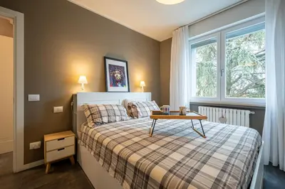 Letto o letti in una camera di GuestHost - Parma Elegant and Sweet Apartments