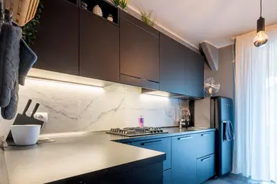 Cucina o angolo cottura di GuestHost - Parma Elegant and Sweet Apartments