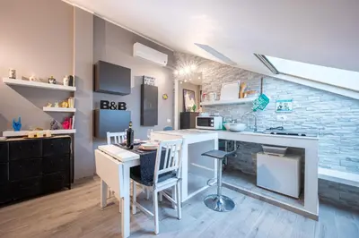 Cucina o angolo cottura di GuestHost - Parma Elegant and Sweet Apartments