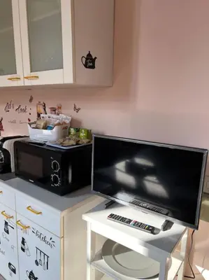 Cucina o angolo cottura di Minimal Studio con travi a vista