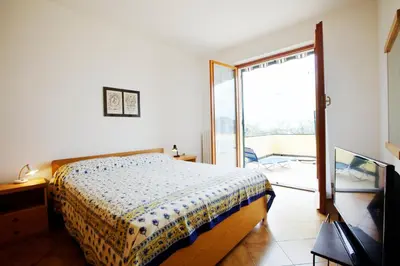 Letto o letti in una camera di Casa Orchidea - Vista Mare meravigliosa
