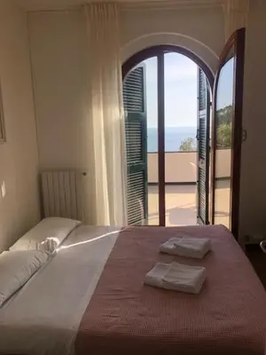 Letto o letti in una camera di Casa Orchidea - Vista Mare meravigliosa