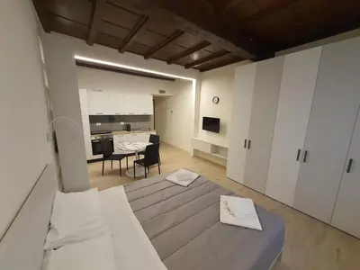 Letto o letti in una camera di RESIDENZA I PORTICI
