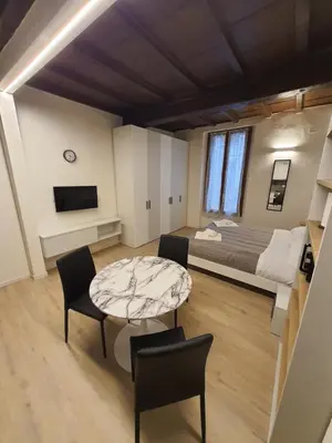 Letto o letti in una camera di RESIDENZA I PORTICI