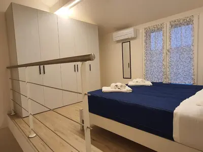 Letto o letti in una camera di RESIDENZA I PORTICI