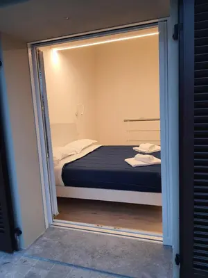 Letto o letti in una camera di RESIDENZA I PORTICI