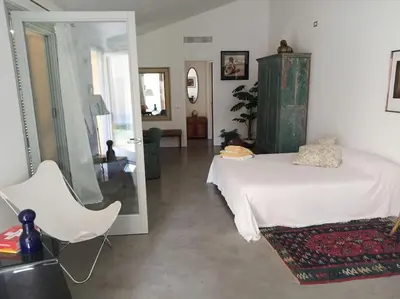 Letto o letti in una camera di Suite per gli ospiti