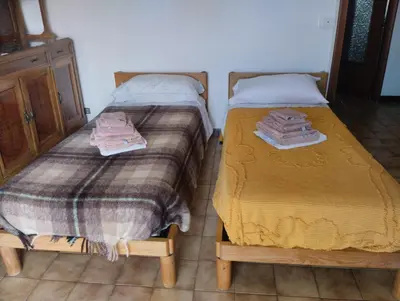 Letto o letti in una camera di Appartamento con posto auto privato comodo a centro e spiagge
