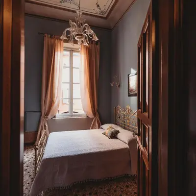 Letto o letti in una camera di Salotto delle Arti